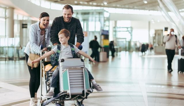 Smiling family at the airport